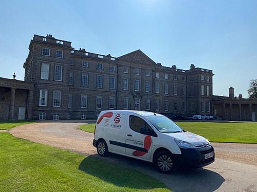 Steeles Removals Van in front of hall